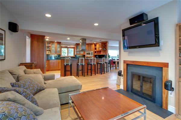 4 Longfellow Road Marblehead, MA 01945 - Photo 8 of 12 a living room with furniture a flat screen tv and kitchen view