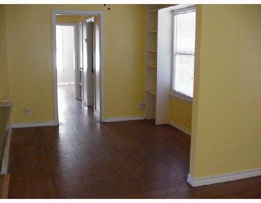 4222 Cott Street Corpus Christi, TX 78411 - Photo 4 of 5 a view of an empty room with wooden floor and a window