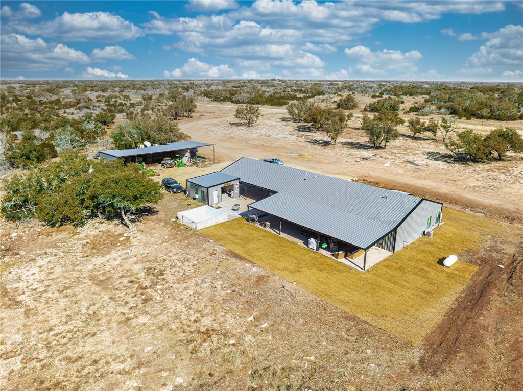 2527 Sutton County Road Ozona, TX 76943 - Photo 3 of 39 an aerial view of residential houses with outdoor space
