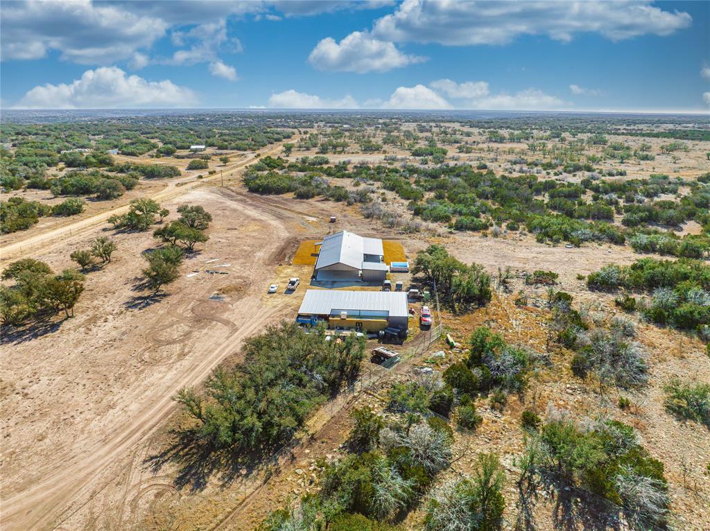 2527 Sutton County Road Ozona, TX 76943 - Photo 10 of 39 an aerial view of residential building and city view