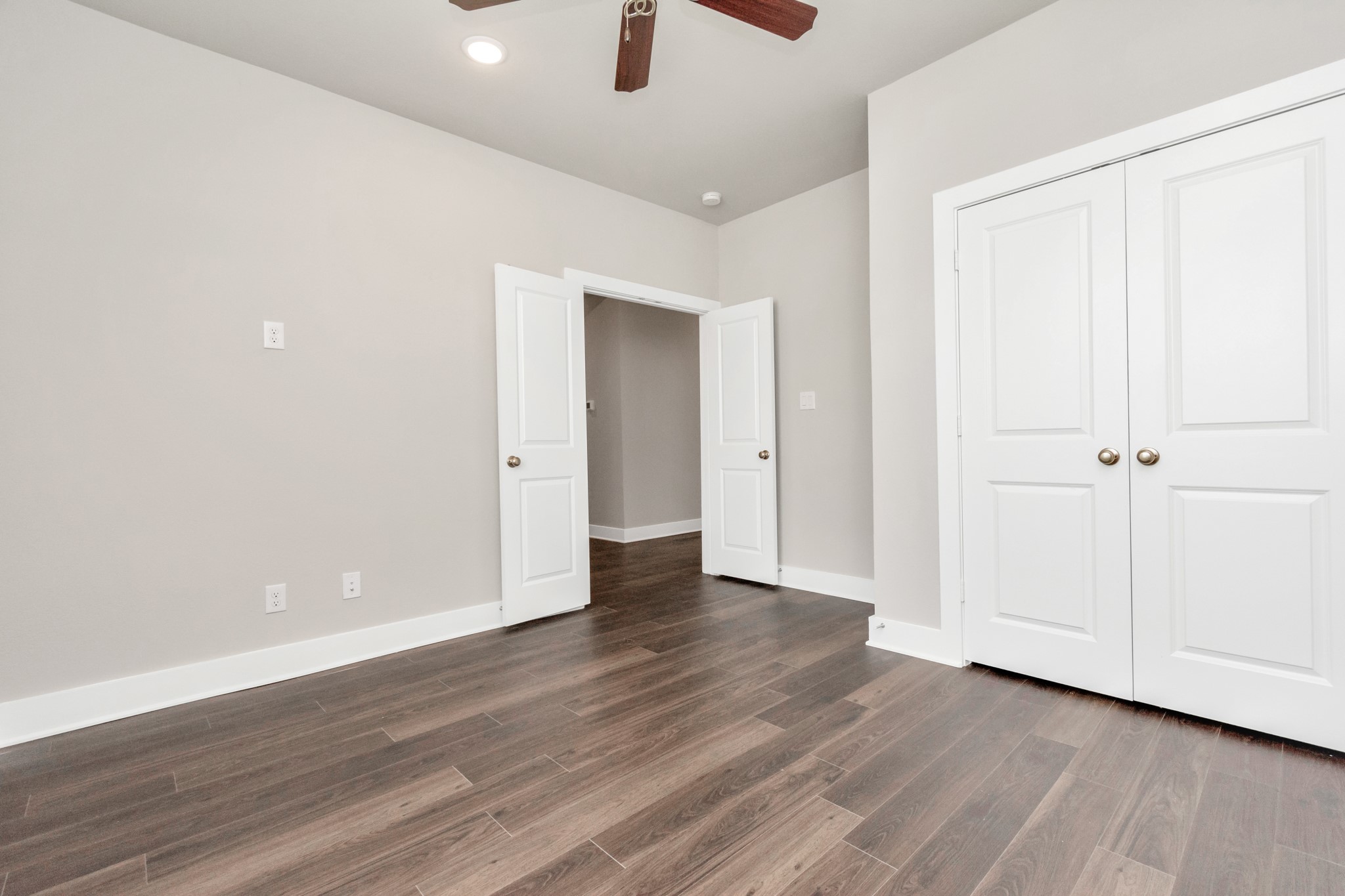 10622 Cascade Crk Drive Rosharon, TX 77583 - Photo 11 of 24 The second bedroom also features luxury vinyl tile floors, a ceiling fan and additional windows.
