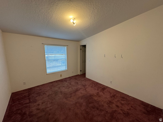 580 East 400 North Spring City, UT 84662 - Photo 20 of 40 Spare room featuring carpet floors and a textured ceiling