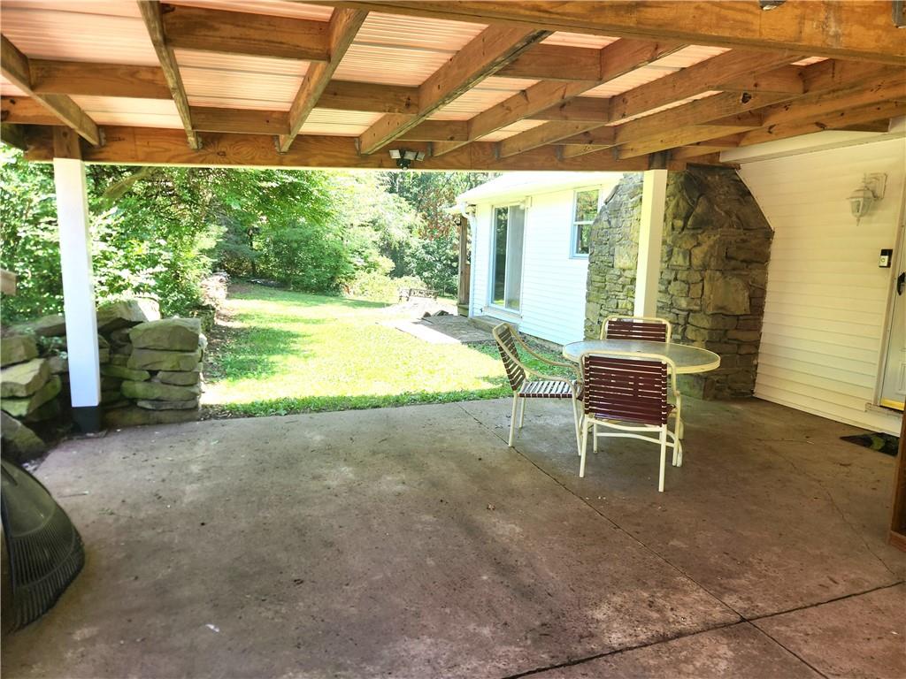 223 South Benbrook Road Butler, PA 16001 - Photo 4 of 31 Covered patio with comfy swing for those summer nights and lovely mornings.