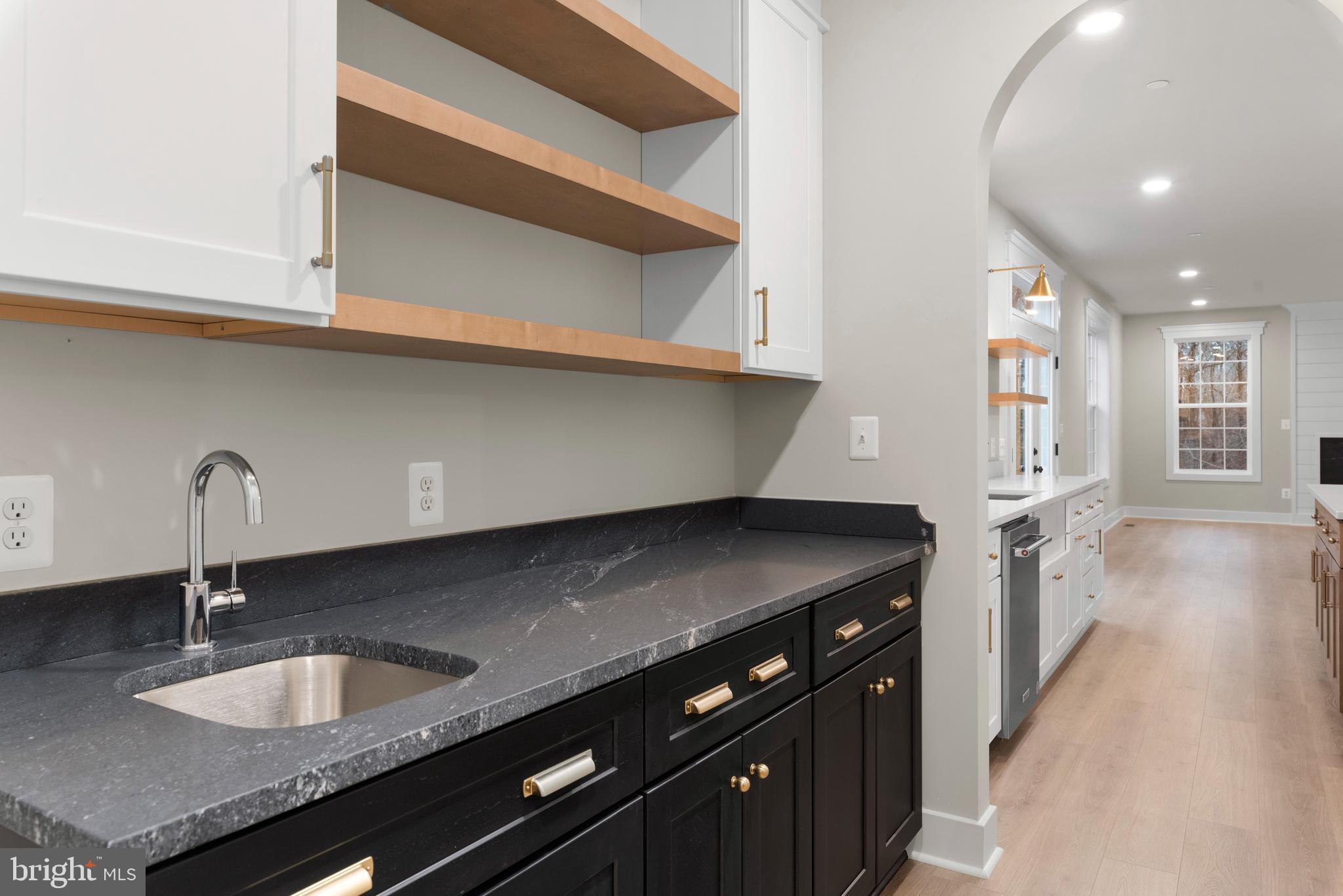 17 Vinter Lane Pasadena, MD 21122 - Photo 13 of 40 a kitchen with granite countertop a sink and a stove