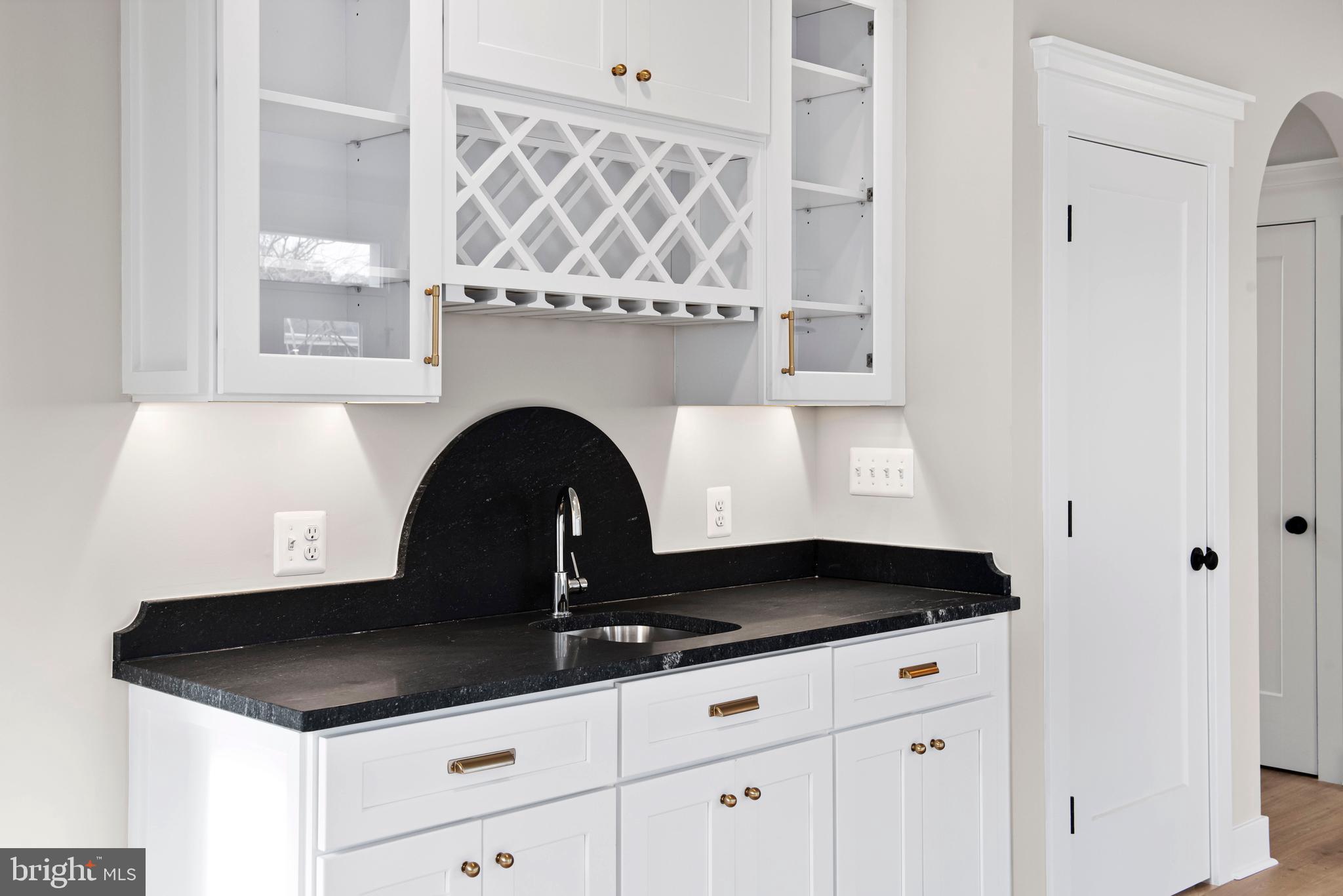 17 Vinter Lane Pasadena, MD 21122 - Photo 17 of 39 a close view of a stove a faucet and a sink