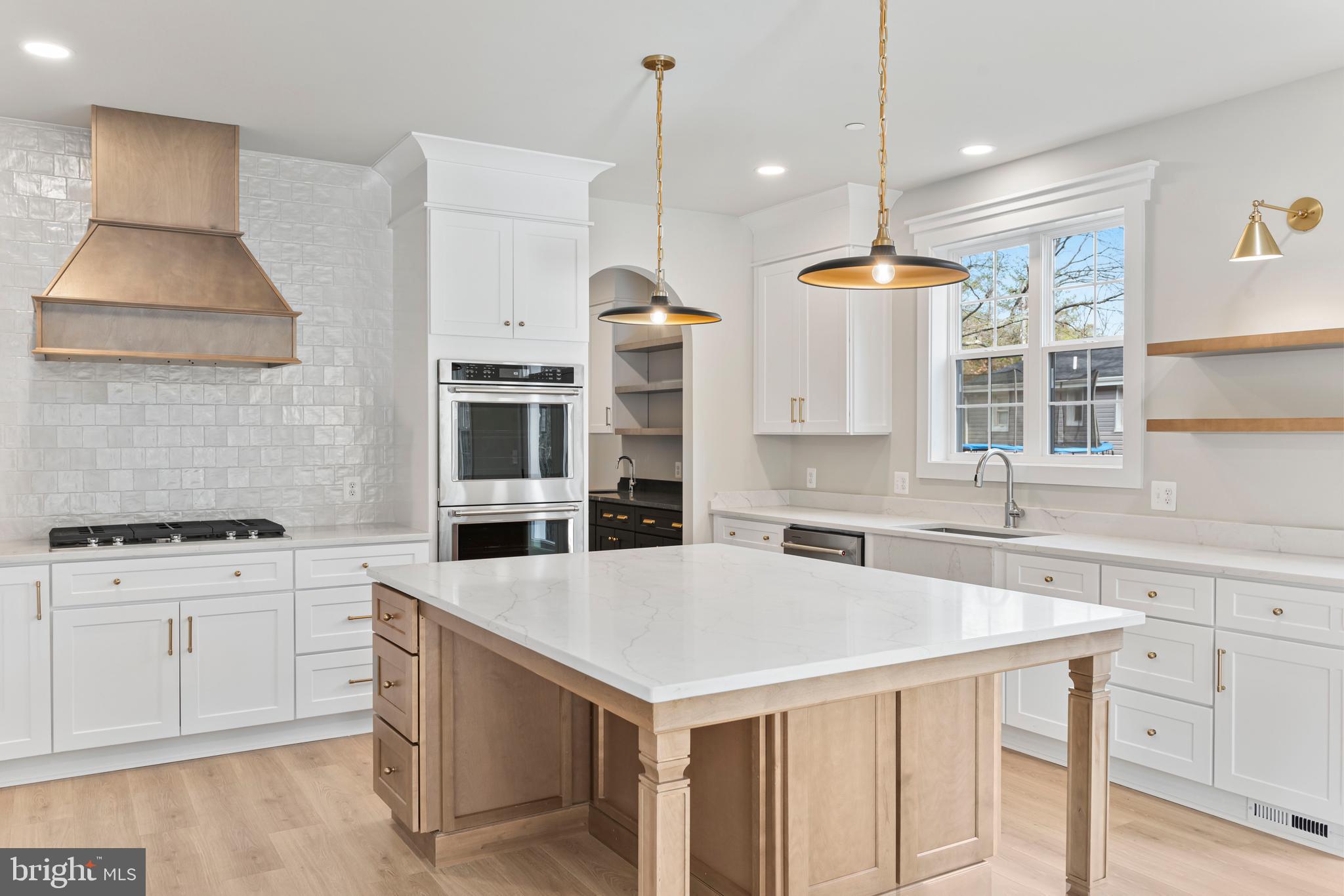 17 Vinter Lane Pasadena, MD 21122 - Photo 2 of 39 a kitchen with a stove a sink and a refrigerator