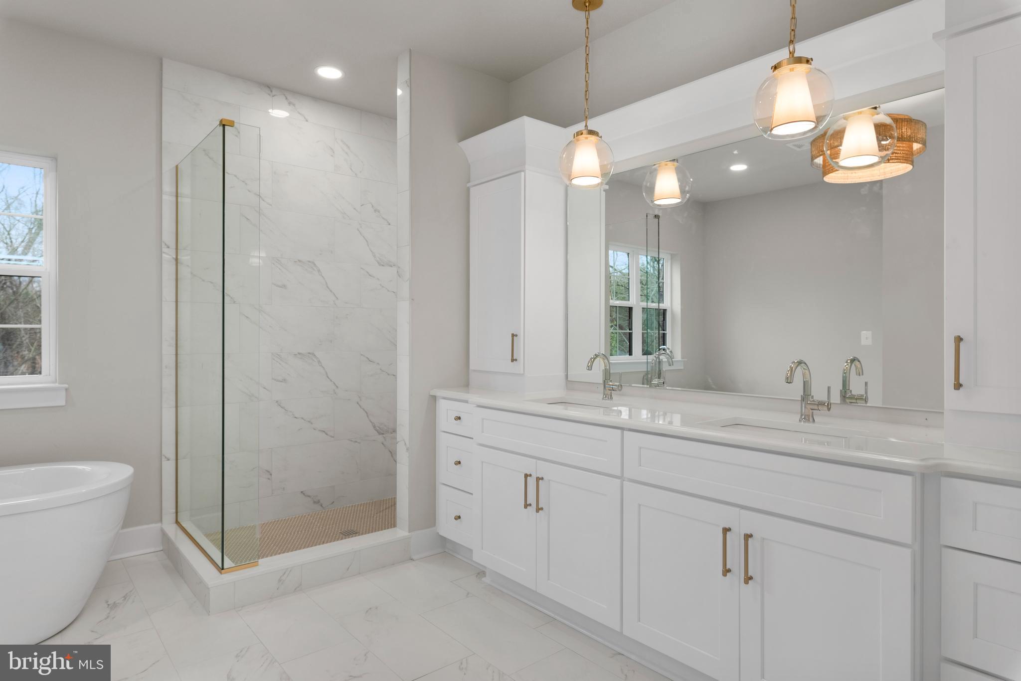 17 Vinter Lane Pasadena, MD 21122 - Photo 24 of 40 a bathroom with a double vanity sink mirror and toilet