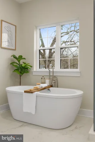 a white bath tub sitting in a bathroom