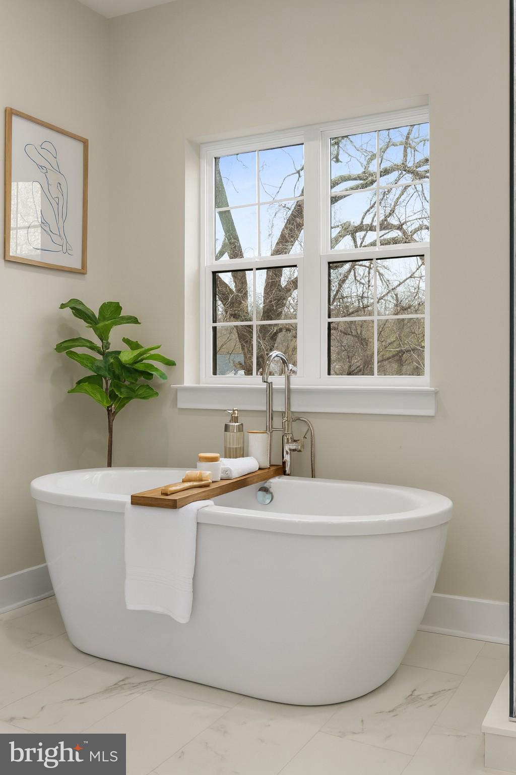 17 Vinter Lane Pasadena, MD 21122 - Photo 26 of 40 a white bath tub sitting in a bathroom