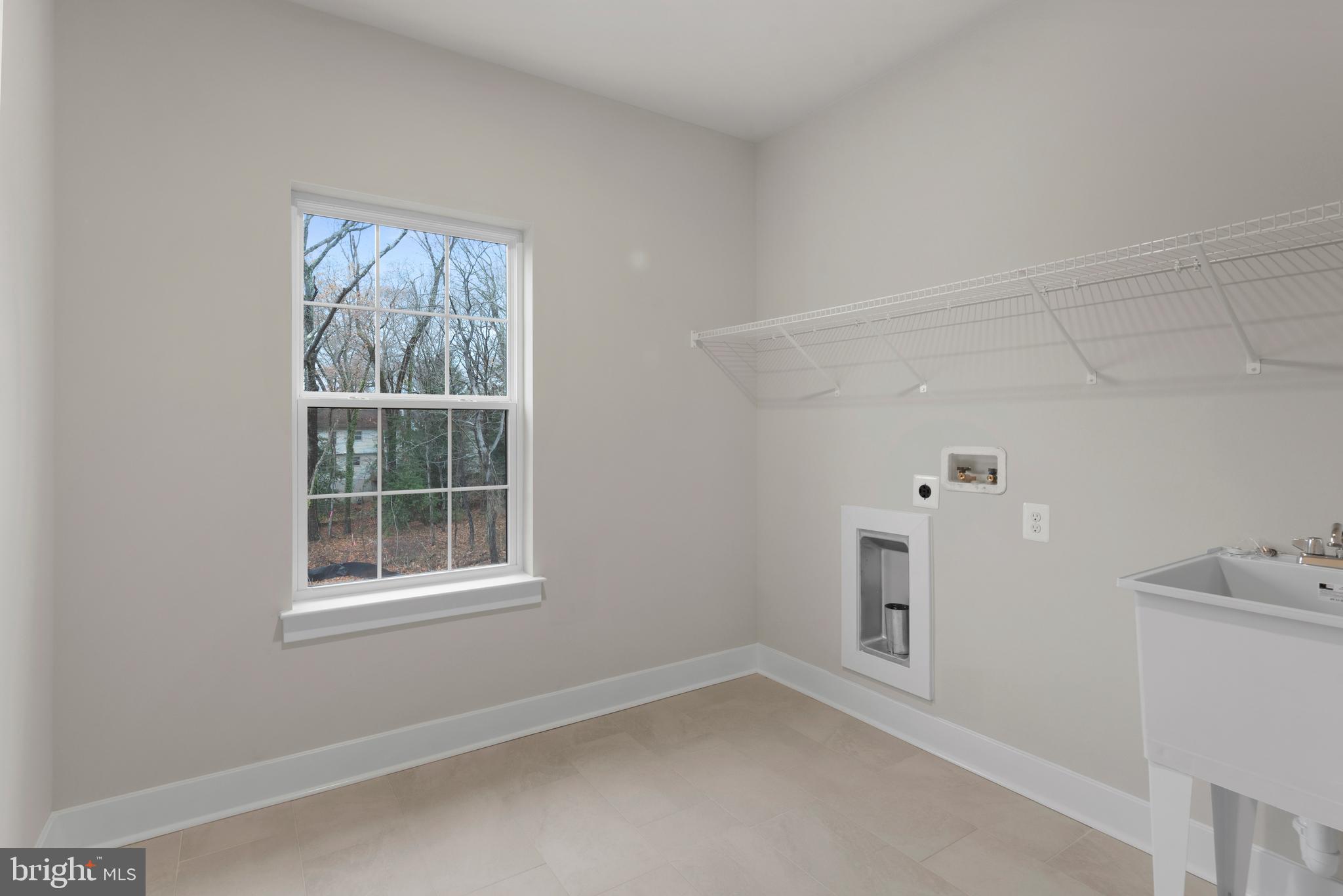 17 Vinter Lane Pasadena, MD 21122 - Photo 31 of 40 an empty room with windows