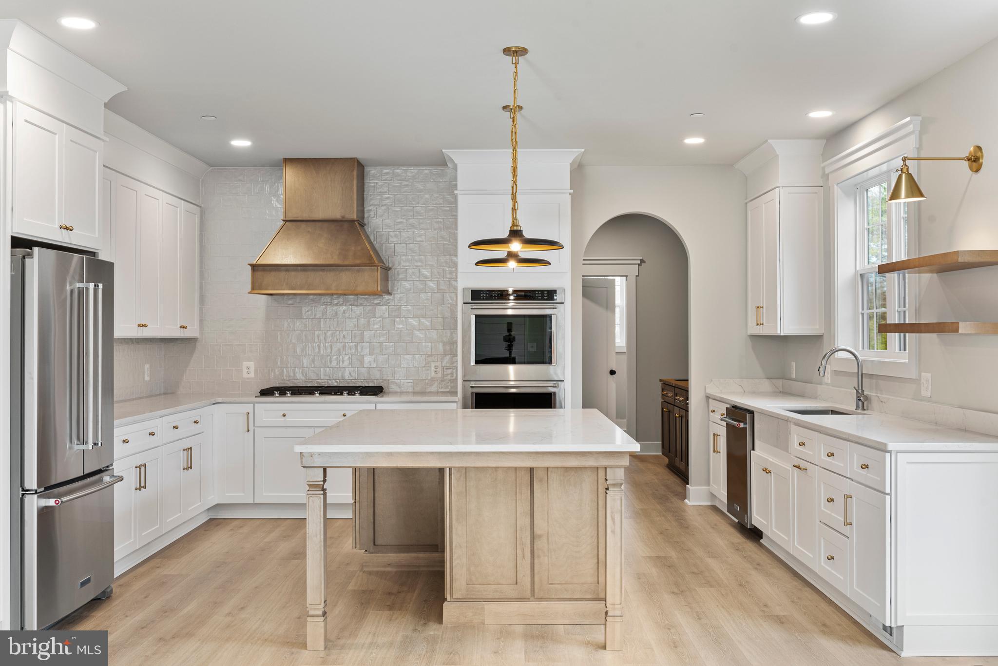 17 Vinter Lane Pasadena, MD 21122 - Photo 6 of 39 a kitchen with granite countertop a sink a stove and a refrigerator