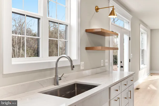 a bathroom with a sink and a window