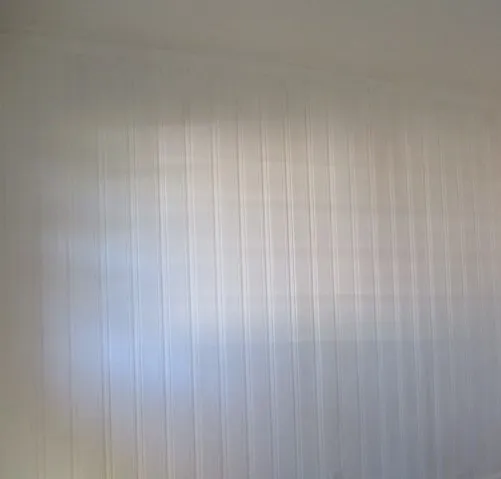 a bathroom with a toilet and bathtub