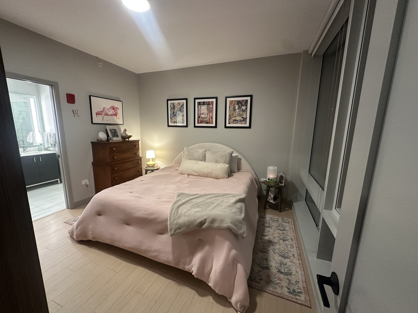 920 North Wells Street, Unit 612 Chicago, IL 60610 - Photo 4 of 14 a bedroom with a bed and a dresser