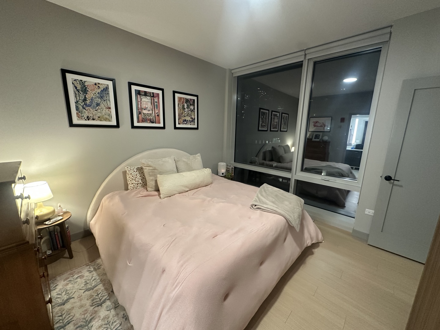 920 North Wells Street, Unit 612 Chicago, IL 60610 - Photo 5 of 14 a bedroom with a bed and a large mirror