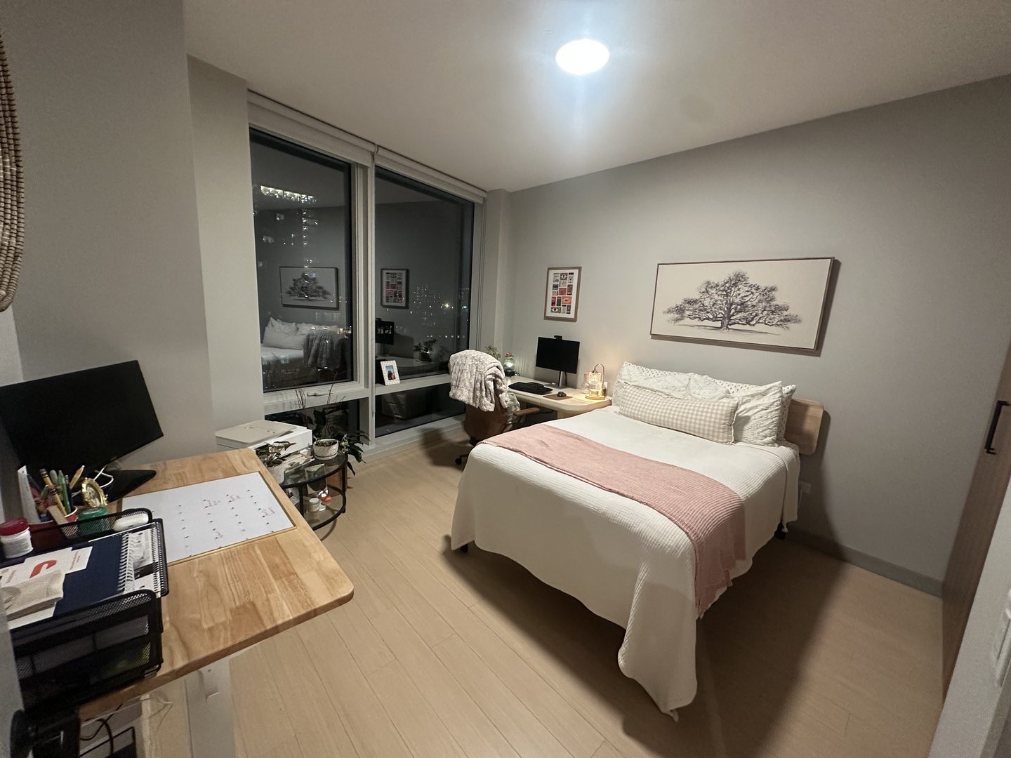 920 North Wells Street, Unit 612 Chicago, IL 60610 - Photo 8 of 14 a bedroom with a bed and wooden floor