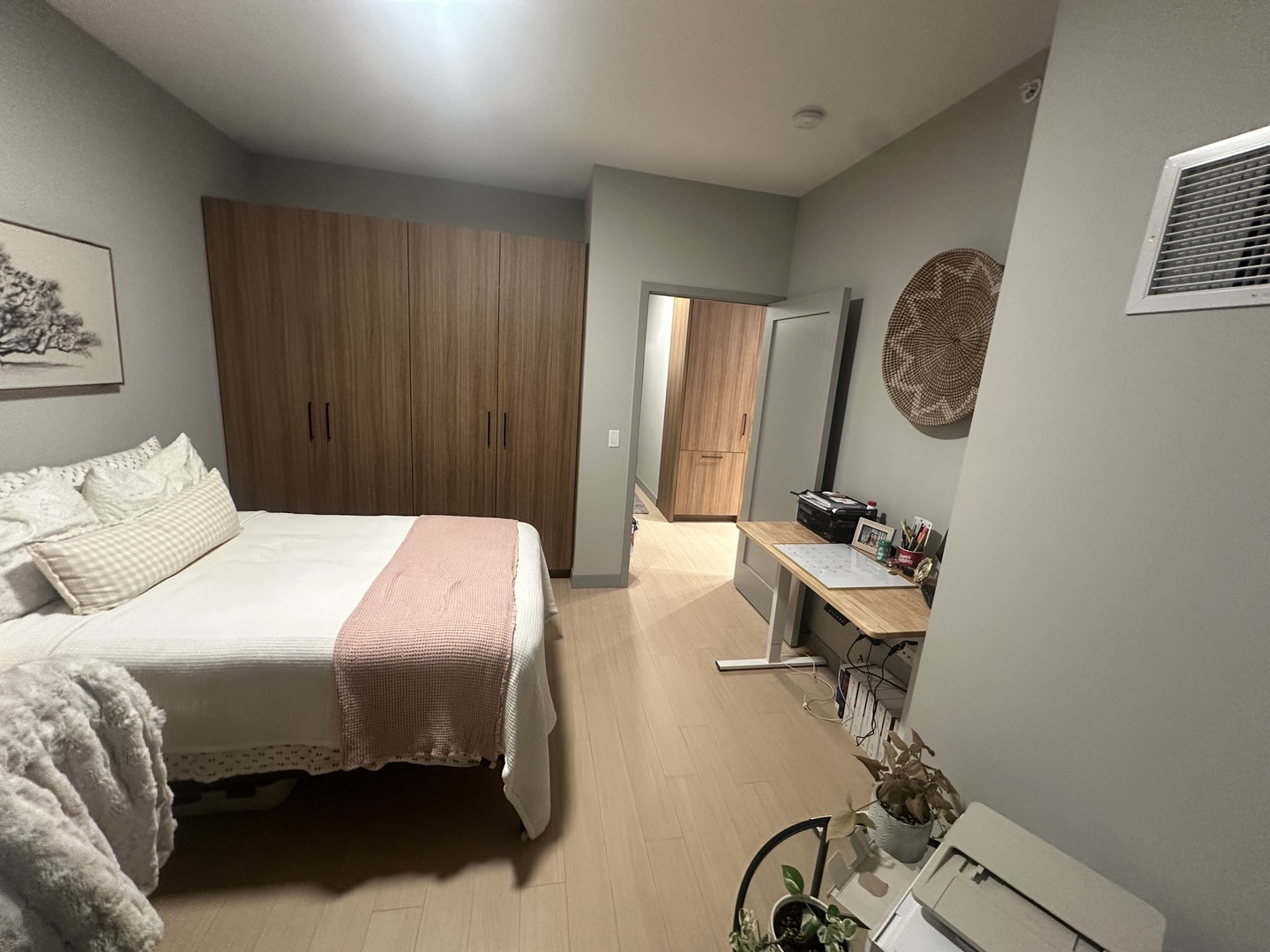 920 North Wells Street, Unit 612 Chicago, IL 60610 - Photo 9 of 14 a bedroom with a bed and wooden floor