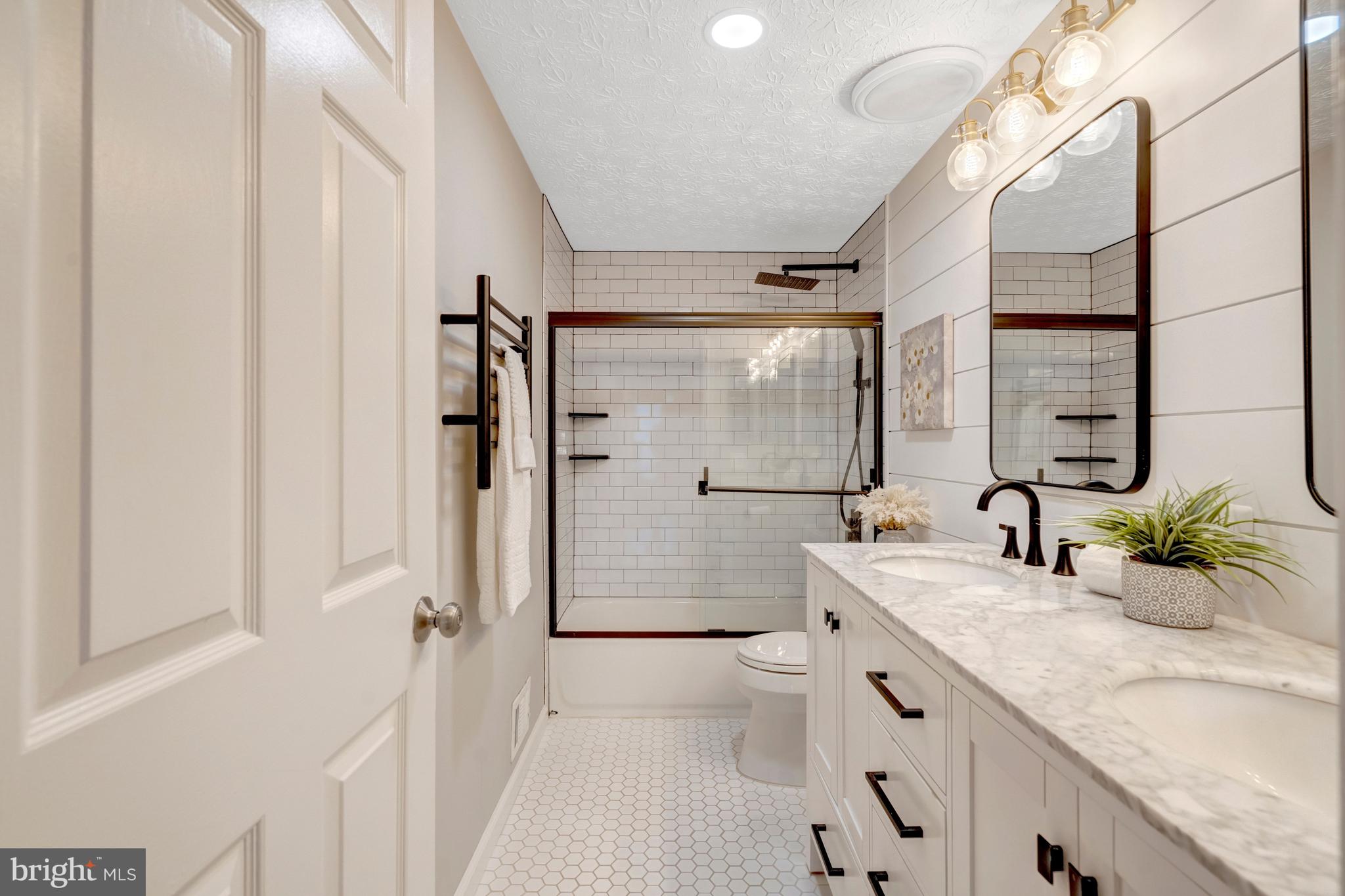 7809 Roundabout Way Springfield, VA 22153 - Photo 52 of 83 Freshly updated bath with crisp style