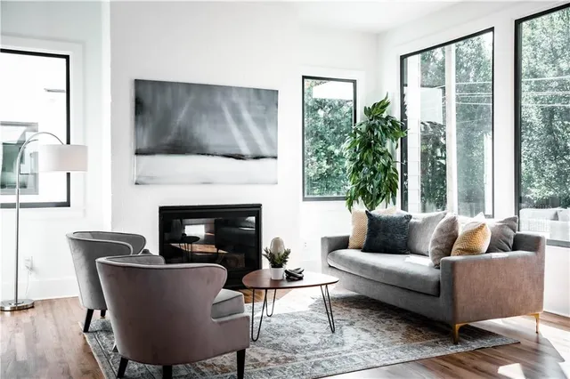 a view of a room with wooden floor and windows