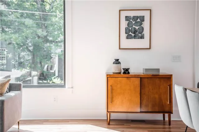a bedroom with a large bed and a large window
