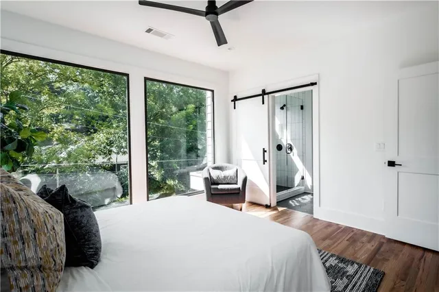 a bathroom with a double vanity sink double mirror and shower