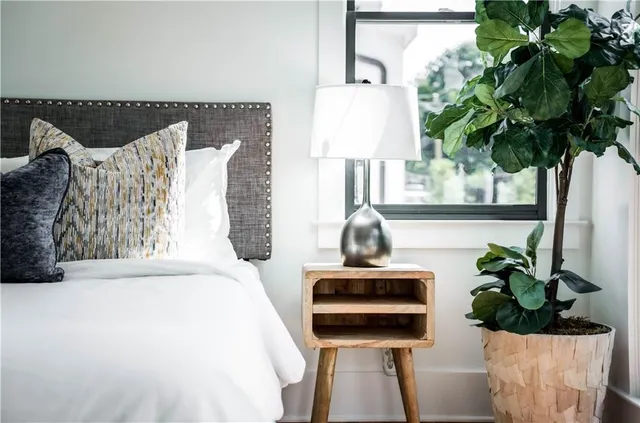 a bedroom with bed and window