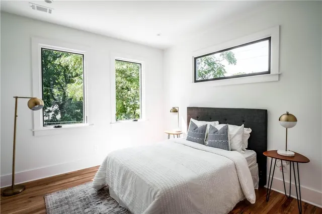 a bedroom with bed and window