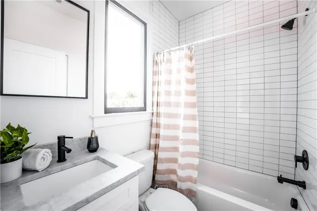 a room that has a window and wooden floor