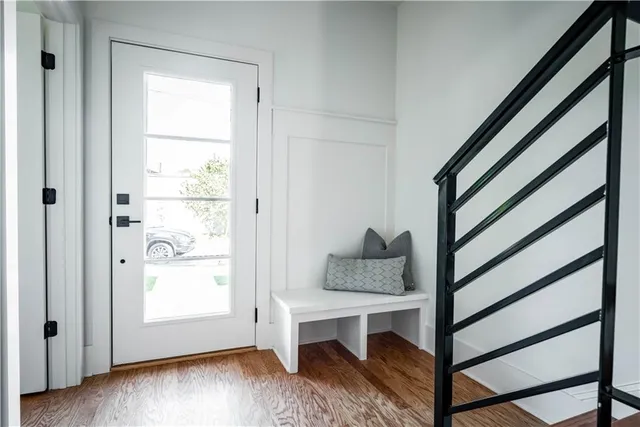 a dining room with furniture and wooden floor