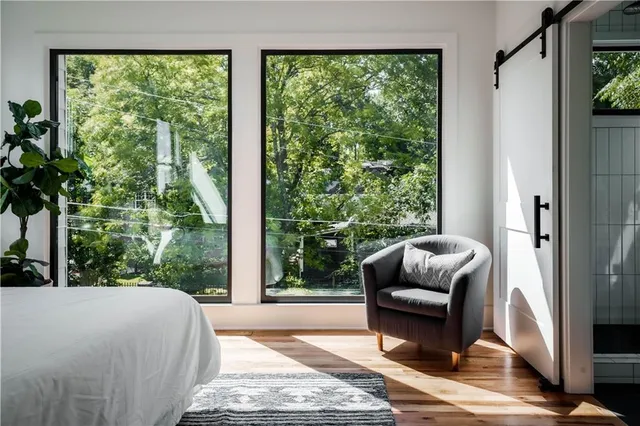 a bedroom with furniture and a window