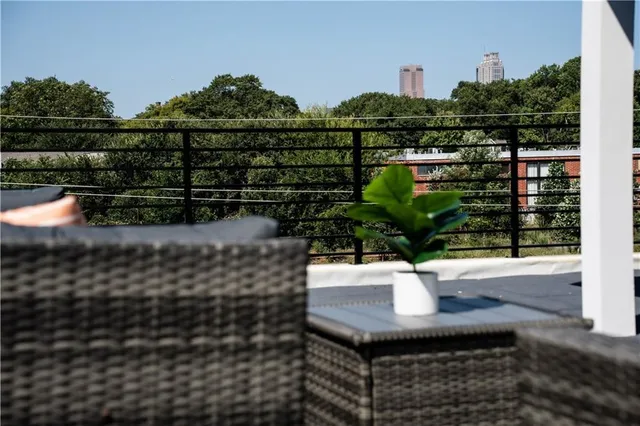 a view of a livingroom with furniture window and wooden floor