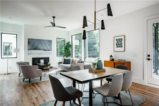 a kitchen with a dining table and chairs