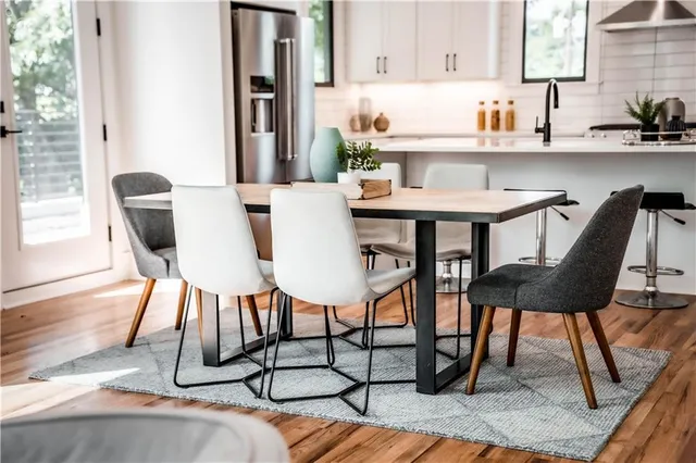 a kitchen with a sink a window and cabinets
