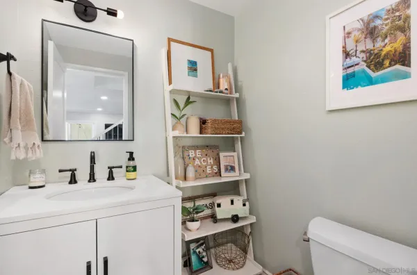 a bathroom with a toilet and a sink