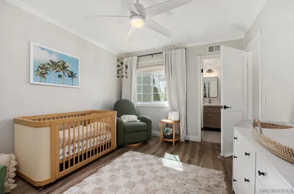 a bedroom with furniture and a window