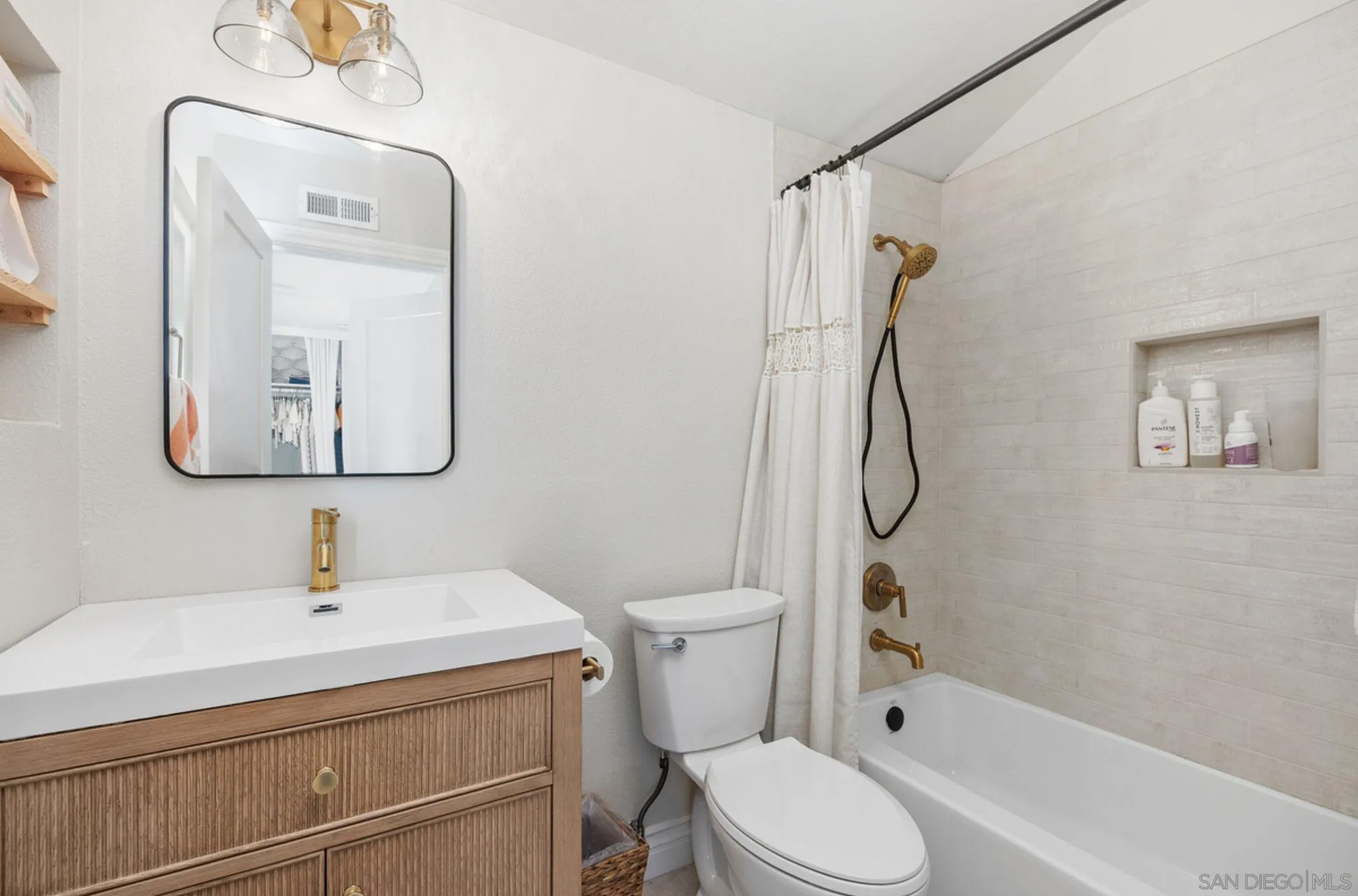1971 Azure Way Encinitas, CA 92024 - Photo 19 of 30 a bathroom with a toilet sink shower and mirror
