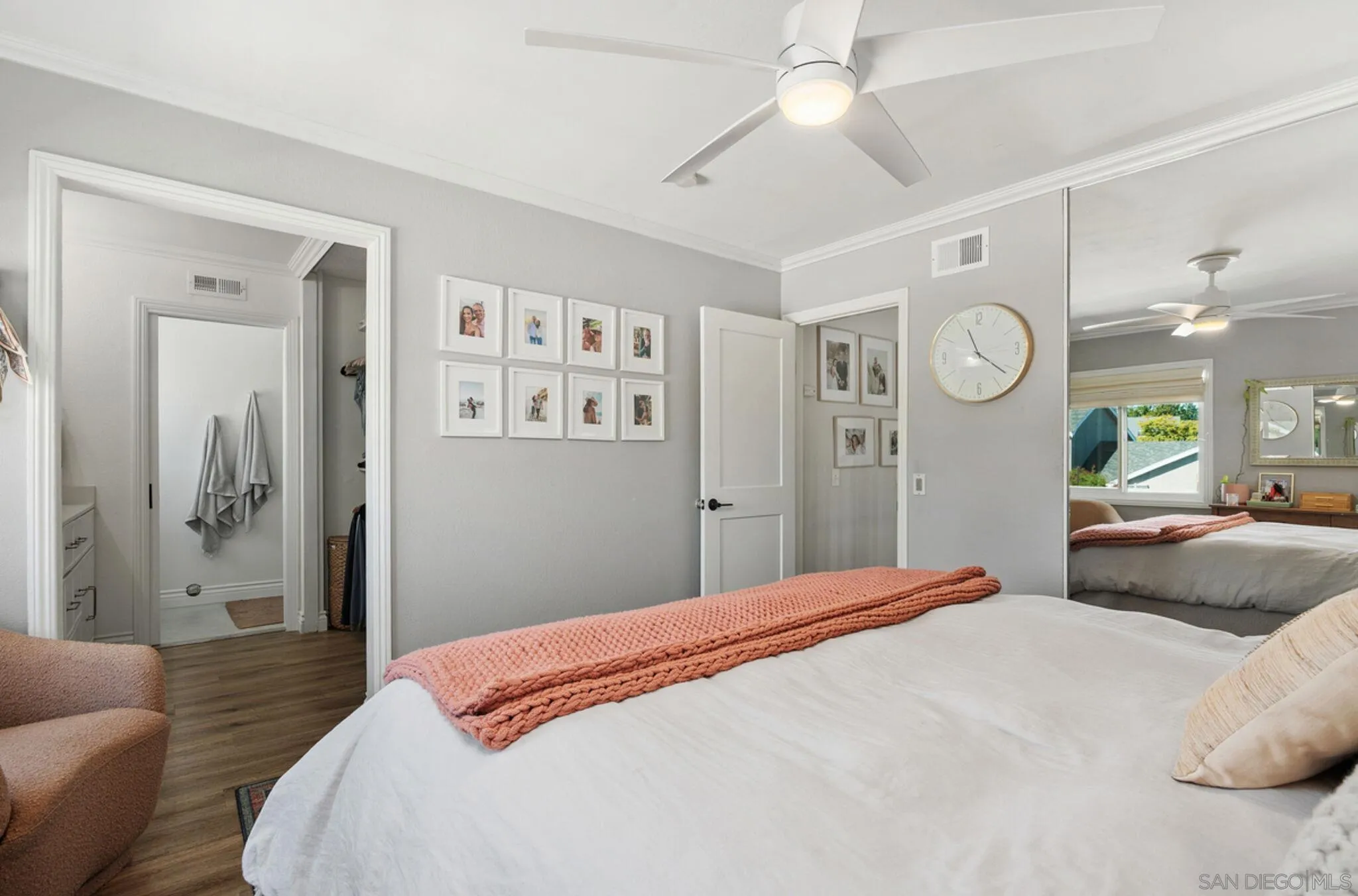 1971 Azure Way Encinitas, CA 92024 - Photo 21 of 30 a bedroom with a bed a mirror and a window