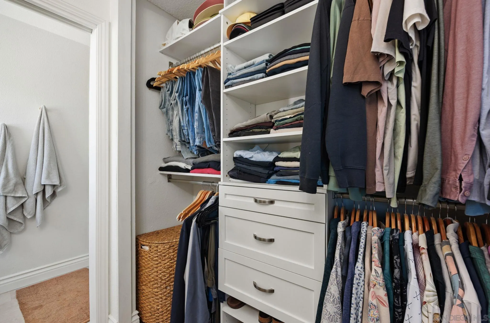 1971 Azure Way Encinitas, CA 92024 - Photo 24 of 30 a view of walk in closet with clothes and shoes