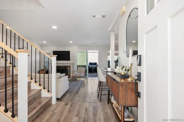 a view of a living room with wooden floor