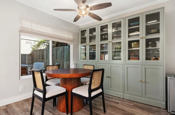 a dining room with furniture and window