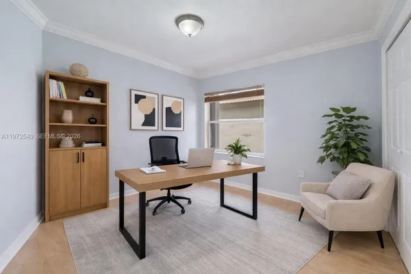 a workspace with furniture and a potted plant