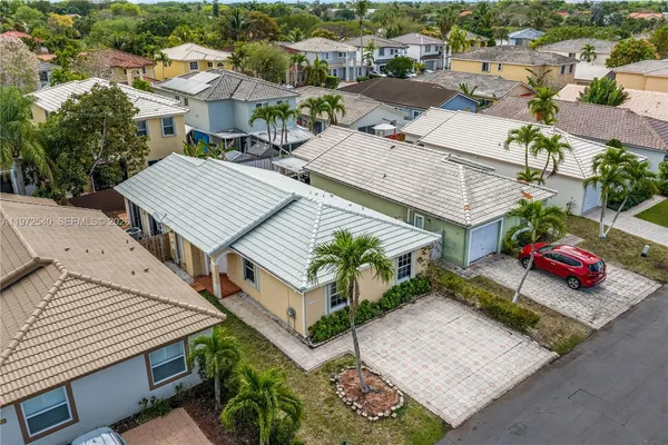 an aerial view of a house with a patio