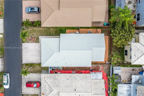 an aerial view of residential houses with outdoor space