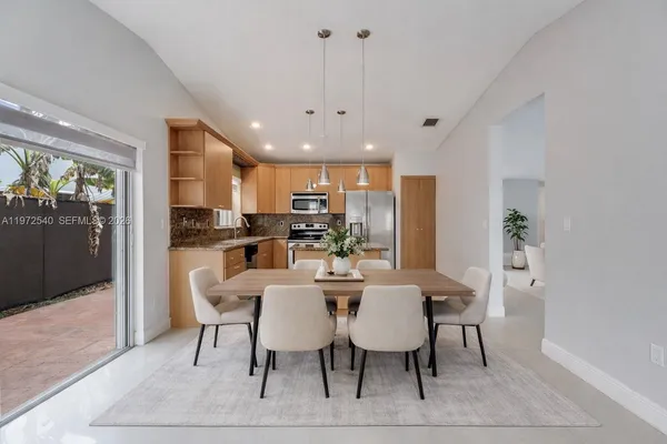 a view of a dining room with furniture