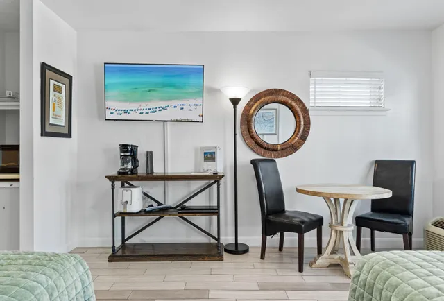 a view of a livingroom with furniture and a table