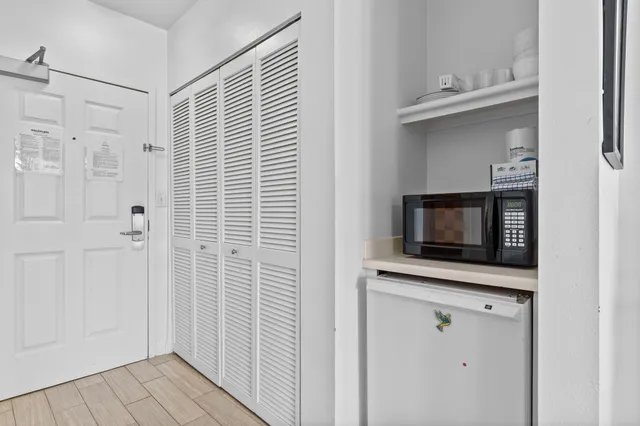 a view of a kitchen from the hallway