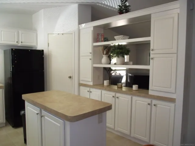 a kitchen with a sink and cabinets