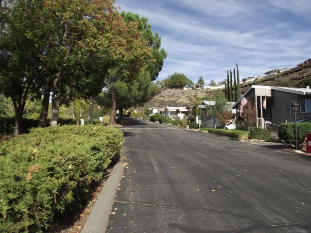 a view of a street with houses on both side