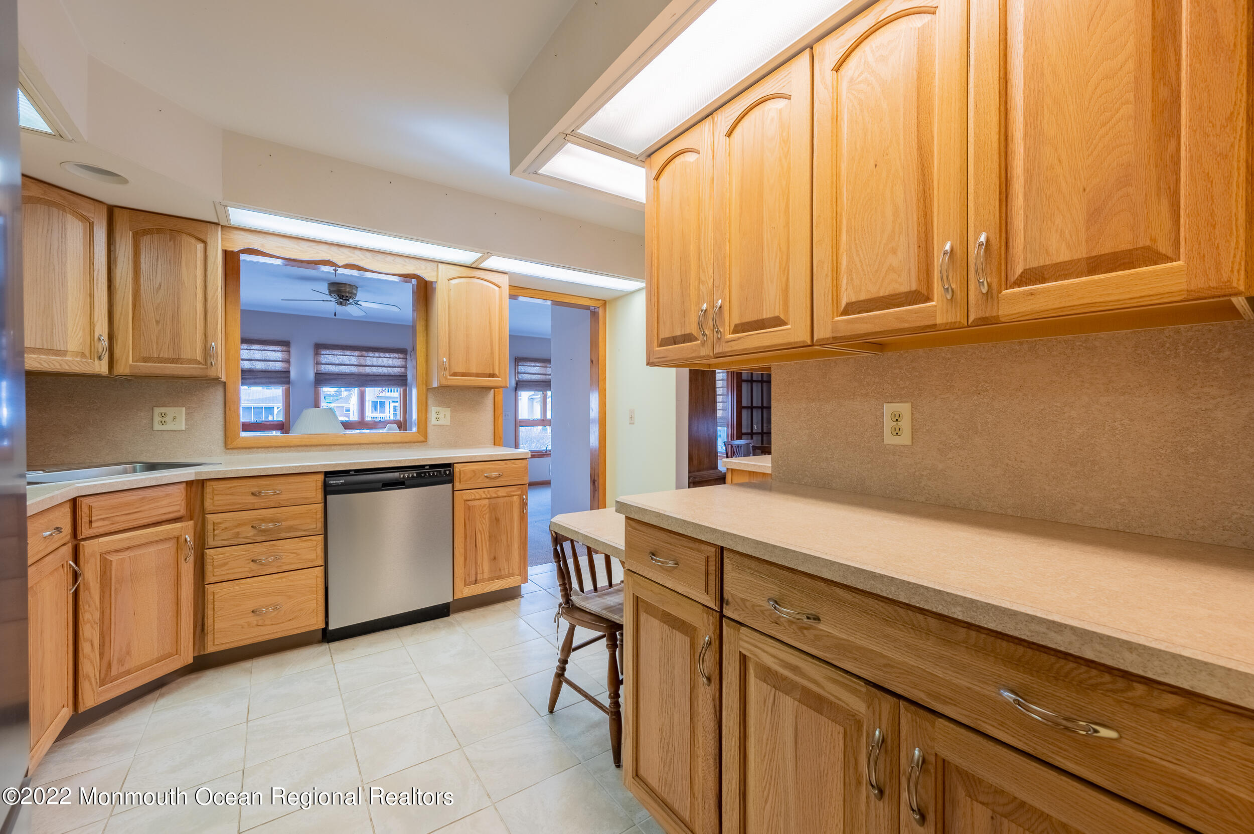23 Neptune Road Toms River, NJ 08753 - Photo 14 of 36 a kitchen with stainless steel appliances granite countertop a sink and cabinets