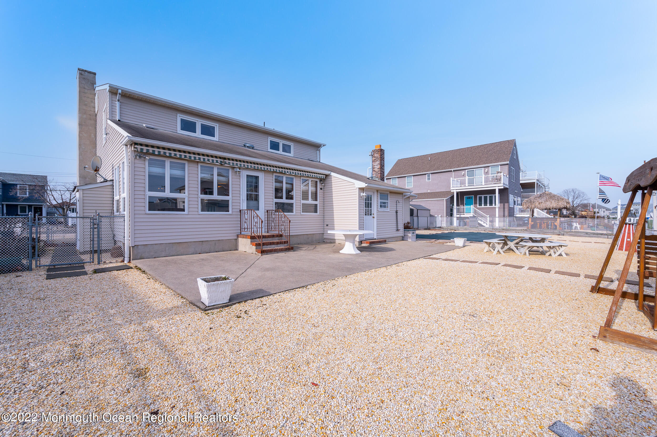 23 Neptune Road Toms River, NJ 08753 - Photo 29 of 36 a swimming pool with outdoor seating and yard